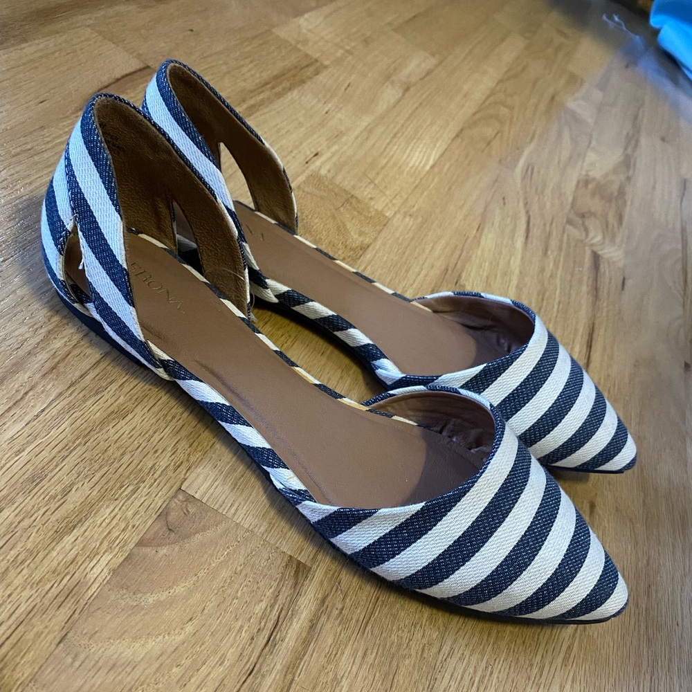Brand new! Navy blue/white striped flats. Padding on the insoles for comfort.
